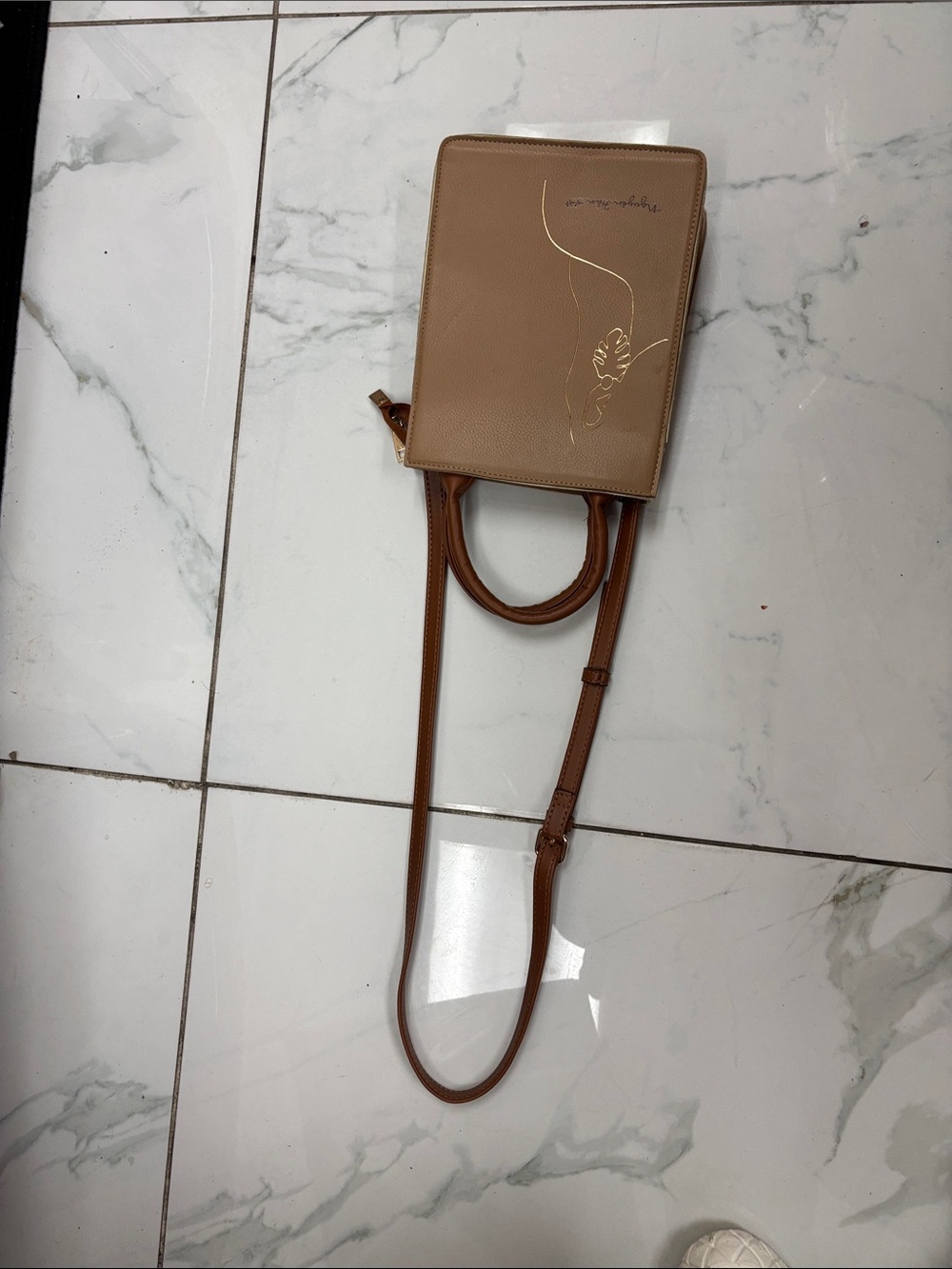 Elegant Tan Crossbody Bag with Gold Butterfly Accent